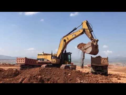 Caterpillar 365C Excavator Loading Mercedes And MAN Trucks