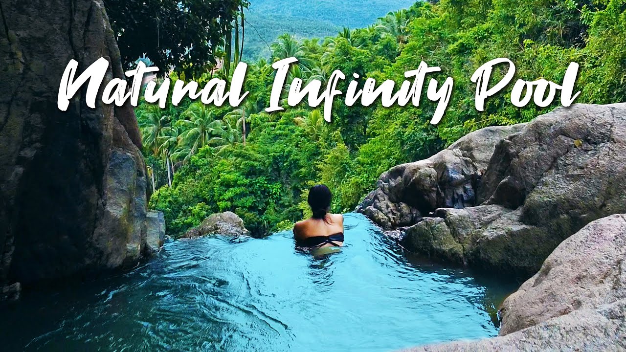 Join the adventure as tourists ascend to the breathtaking Na Muang Waterfalls in this video.