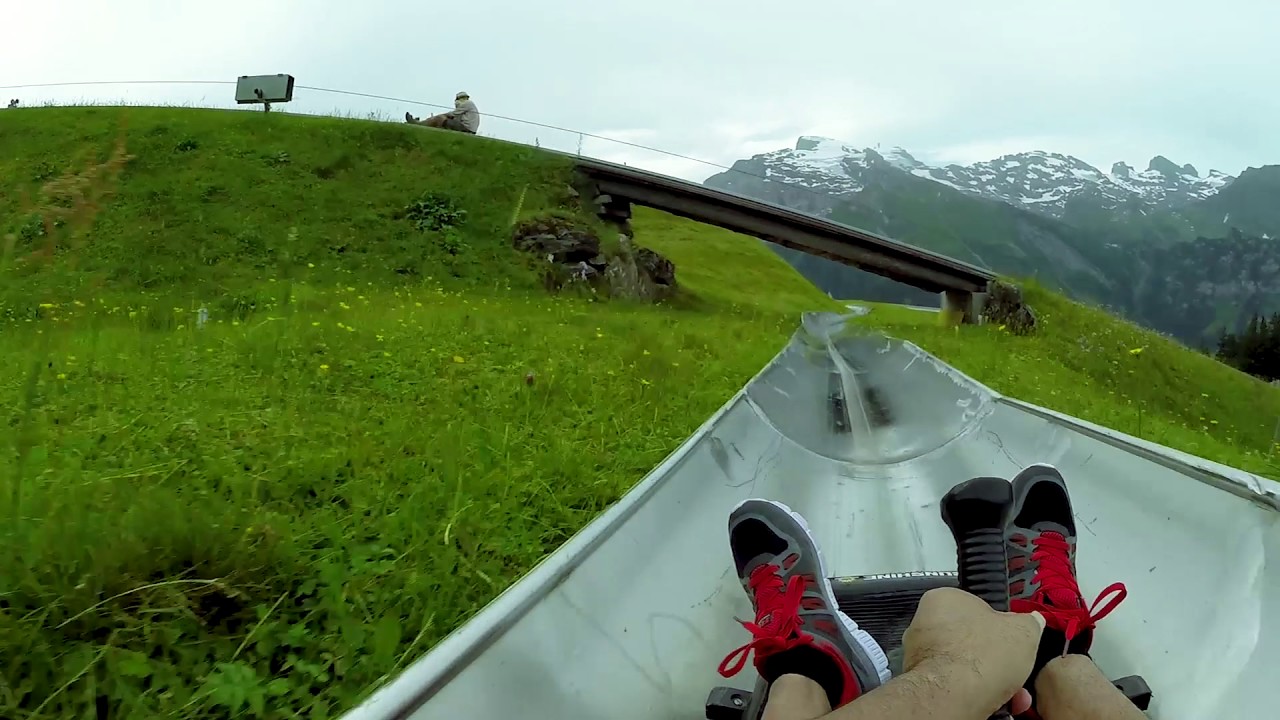 Experience toboggan run at Engelberg with mountain views.