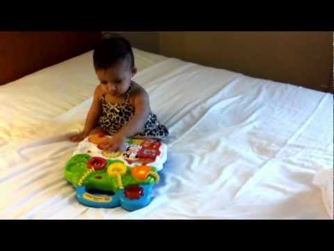 Half toy of half birthday(6months) keeps Aarini busy!!