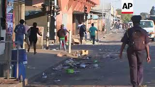 Soldiers and riot police chasing protesters in Harare