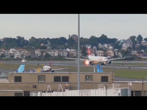 Flames shoot out of Swiss Airlines plane while on runway at Logan Airport