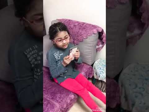 Little girl talking  to hey Siri
