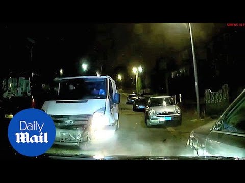 Shocking moment white van rams into police car at speed in Salford - Daily Mail