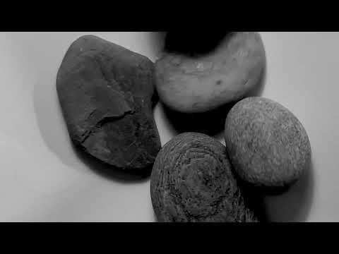 river rocks and one human hair