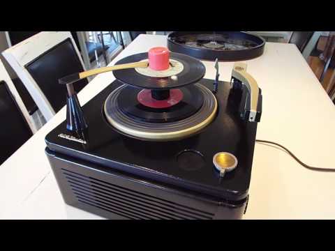 RCA record player playing a stack of 45 RPM records.