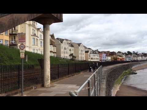 Colas rail track tamper DR 73935 passing Dawlish