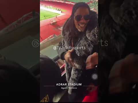 Rigobert Song and Samuel Eto'o celebrating Christian Kofane's goal against Mozambique