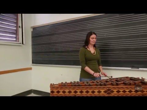Graduate student performs the Rey K'iche