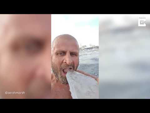 Ruso come hielo y helado en lago congelado