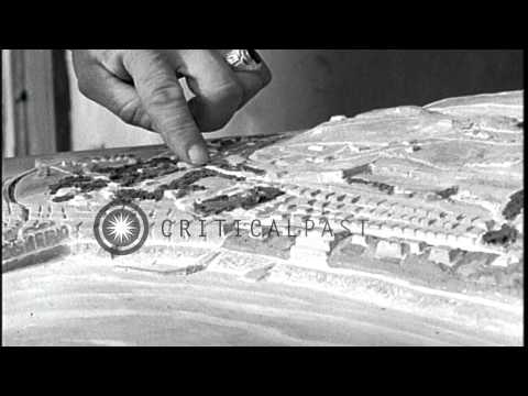 Officers examine a miniature table map of Anzio beachhead and activities of soldi...HD Stock Footage