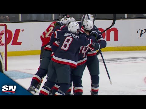 USA's Jake Sanderson Sends Rebound Through Traffic And Past Jordan Binnington