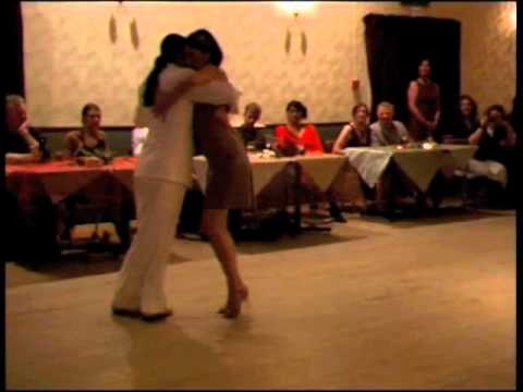  Adrian Costa  and  Amanda Costa  are  dancing  to  the  milonga  "  Milonga De Antano  "