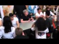 One direction fan faints holding Zayn Maliks hand.