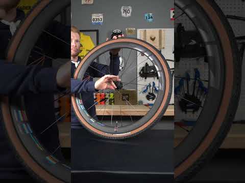 Witness the artistry of assembling Zipp 303 Firecrest wheels in the captivating 'Force' colorway