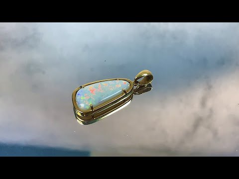 18kt Yellow Gold freeform White Opal 6.74ct pendant