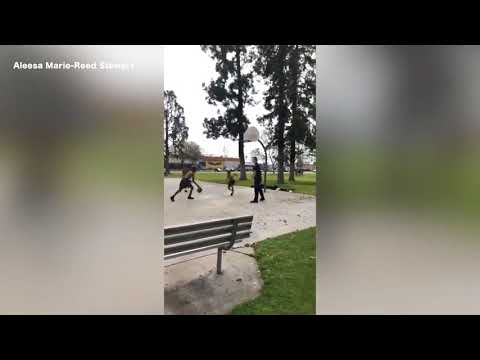 Bakersfield police officer shoots hoops with kids at local park