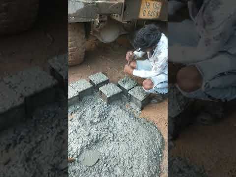 Concrete cube casting at site for strength test.