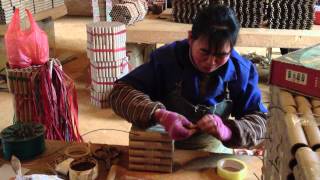 preview picture of video 'INSIDE A CHINESE FIREWORK FACTORY - A CHINESE WORKER MAKING BARRAGES'