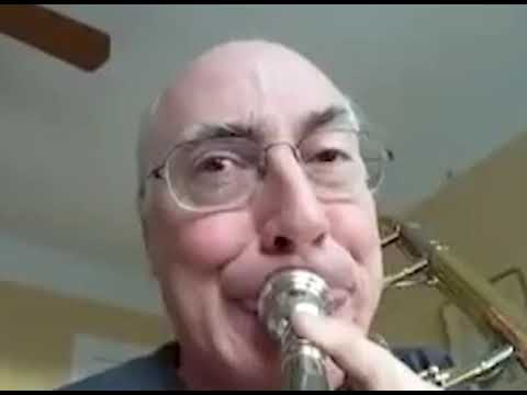 man playing trombone with gopro but it's stabilized to his face