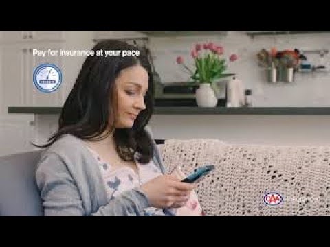 Woman sitting on a couch using a cell phone
