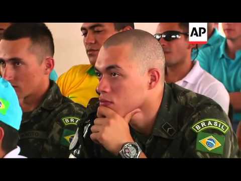 Brazilian UN peacekeepers gather to watch the hosts clash with Mexico