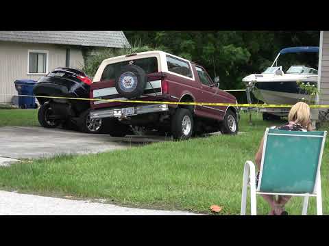 08-13-2021 Palm Harbor, FL-Sinkhole swallows cars in driveway