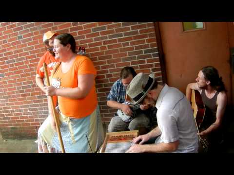 The Knox County Jug Stompers stay dry while playing 'Rocky Top'.