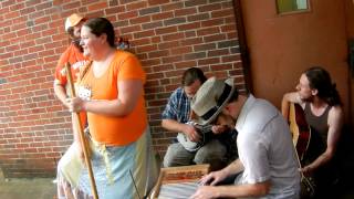 The Knox County Jug Stompers stay dry while playing 'Rocky Top'.