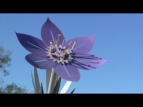 Community members, leaders gather at Blossom Park for sculpture dedication ceremony.