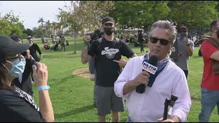 Protesters surround San Diego reporter during live report