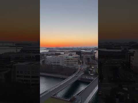 Thumbnail for Stunning Sunrise Lit SkyOver Yokohama as Diamond Princess Cruise Ship Approaches Yokohama Bay Bridge