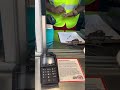 Walmart gas station attendant looks for 2022 quarter with back facing in God we trust.