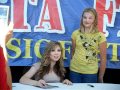 Jennette Mccurdy At The Delta Fair 2010 Little Boy Putting Finger Behind Her Head