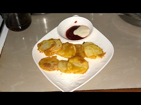 Frying battered potatoes in open fire stove Fiji Style Cooking #fijiflavors #nimmidvlog