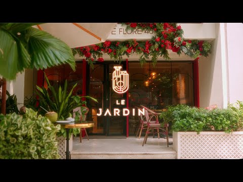 Chef plating a modern Vietnamese fine dining dish at Khuê Restaurant