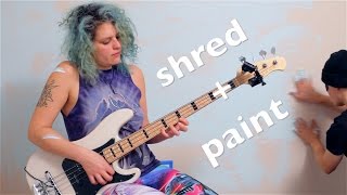 shredding bass Adrian Belew Power Trio's "e"  while a boy paints.
