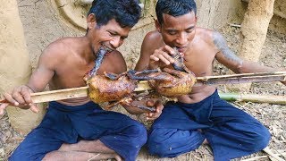 Catch two water duck in river by hand and cook in forest
