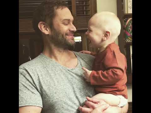 baby laughs at dad's sneezes