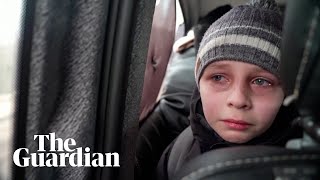 &#39;We left our Dad in Kyiv&#39;: young Ukrainian boy in tears after fleeing capital