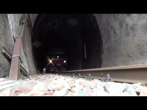 REGIONALE 22972 RIPRESO DA TERRA IN USCITA DALLA GALLERIA. VERNANTE (CN) 25 - 3 - 2016.