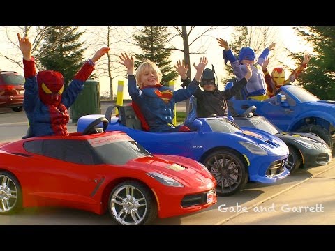 Superhero Race - 5 Superheroes Power Wheels Race!