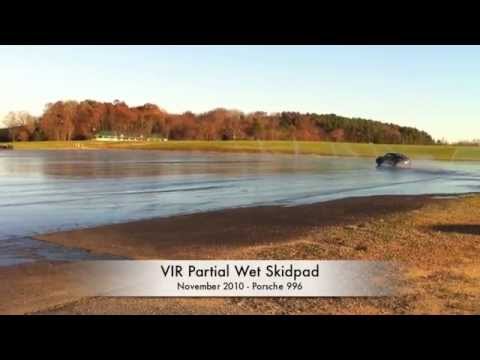 Porsche 911 Carrera drifting at VIR's (partially) wet skidpad.