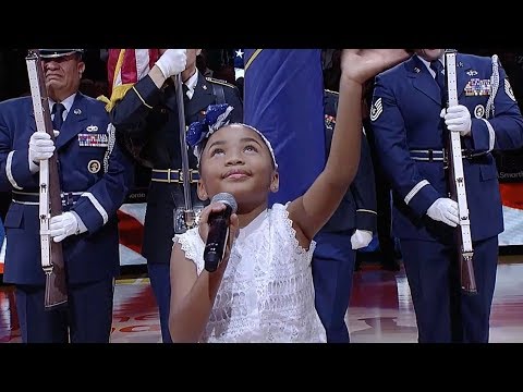 Six-year-old Victory Brinker sings the anthem before the Jazz game