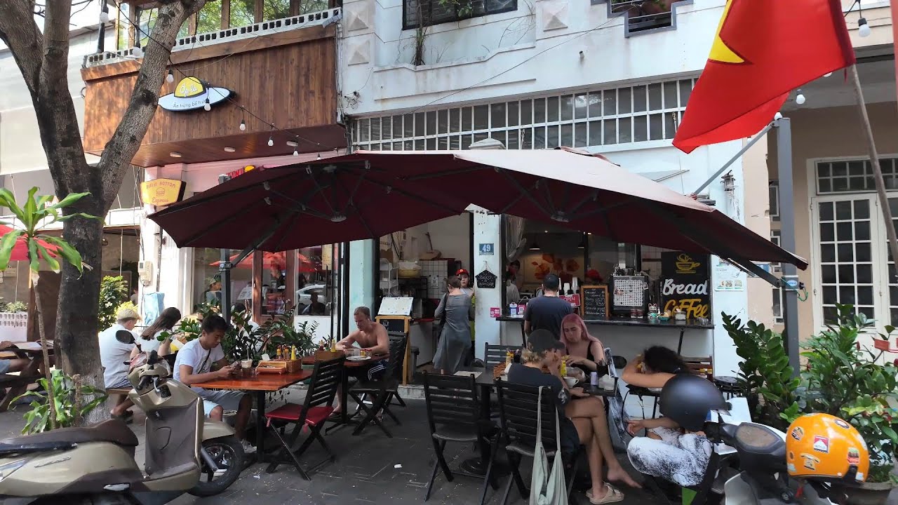 Immersive street-level walking tour through Da Nang, Vietnam, showcasing authentic urban landscapes, local architecture, and the vibrant atmosphere of the city's neighborhoods