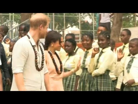 Prince Harry and Meghan leave school in Abuja after kicking off a mental health summit | AFP