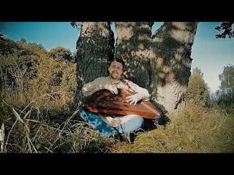 Traditional Russian music instrument gusli (russian harp) at the sacred oak tune