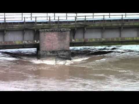 The River Severn battering this railway bridge at Over Jn