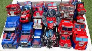Box full of Optimus, Nemesis prime Blue cars Transformers 7 AUTOBOT TOY truck, Robot Transfiguration