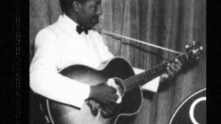 Lonnie Johnson (1899-1970) playing with the strings, 1928.